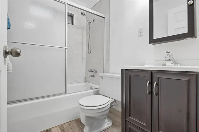 a view of a house with a yard and tree s