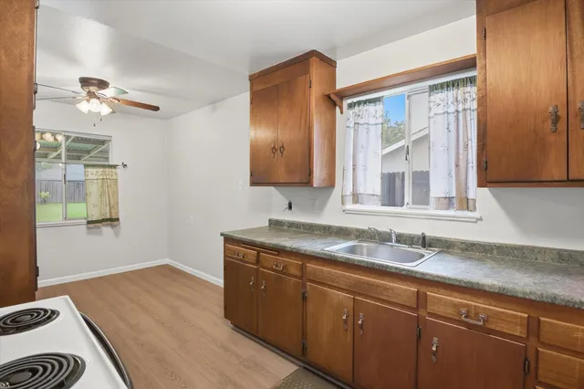 a bathroom with a sink a mirror and a shower