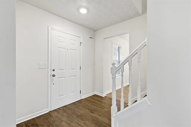 a view of entryway with wooden floor