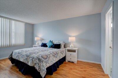 2018 South Federal Highway, Unit A301 Boynton Beach, FL 33435 - Photo 12 of 32 a bedroom with a bed and window