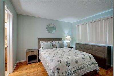 2018 South Federal Highway, Unit A301 Boynton Beach, FL 33435 - Photo 17 of 32 a bedroom with a bed and a lamp