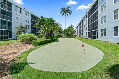 2018 South Federal Highway, Unit A301 Boynton Beach, FL 33435 - Photo 25 of 32 a view of outdoor space yard and swimming pool