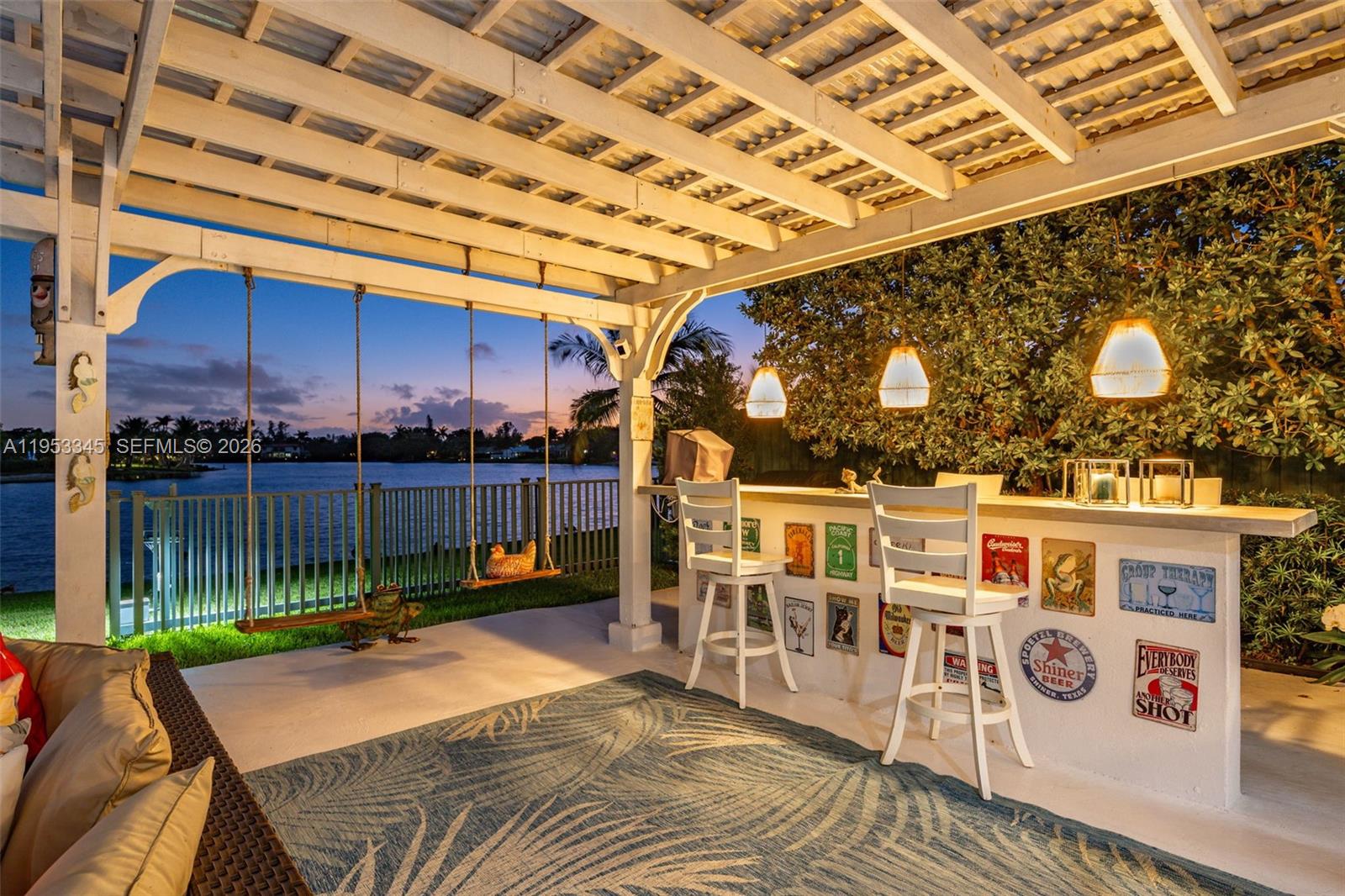 6830 Winged Foot Drive Hialeah, FL 33015 - Photo 22 of 28 a view of a patio with a table and chairs
