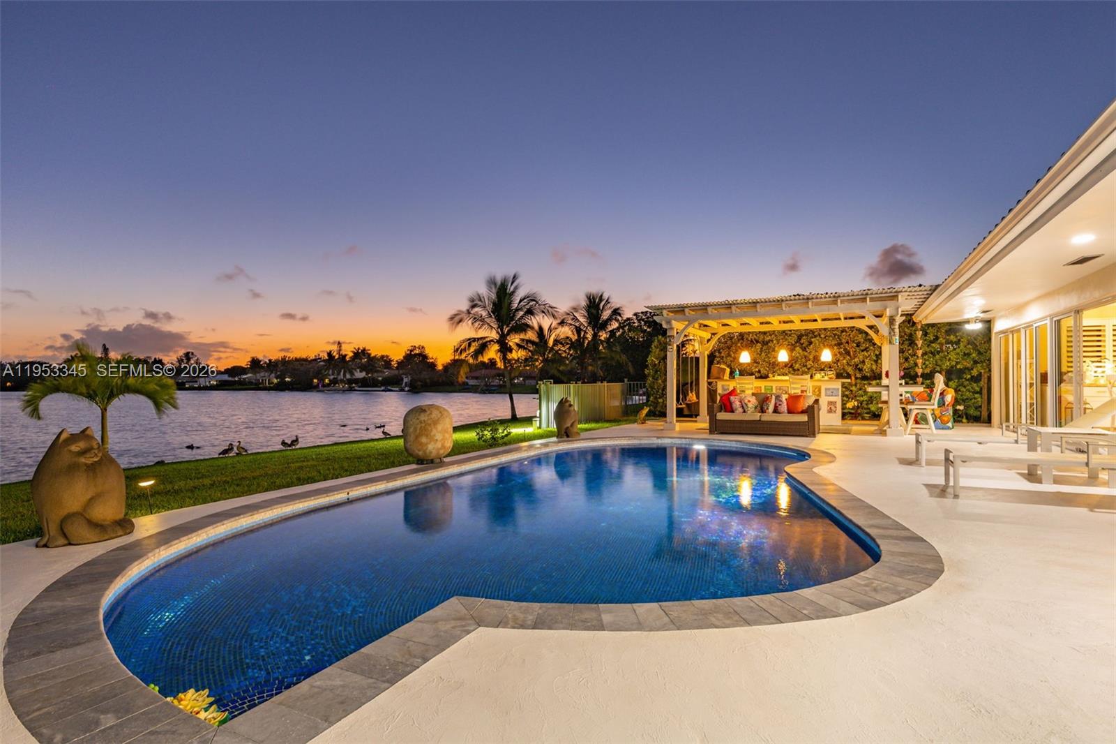 6830 Winged Foot Drive Hialeah, FL 33015 - Photo 26 of 28 a view of swimming pool with outdoor seating and city view