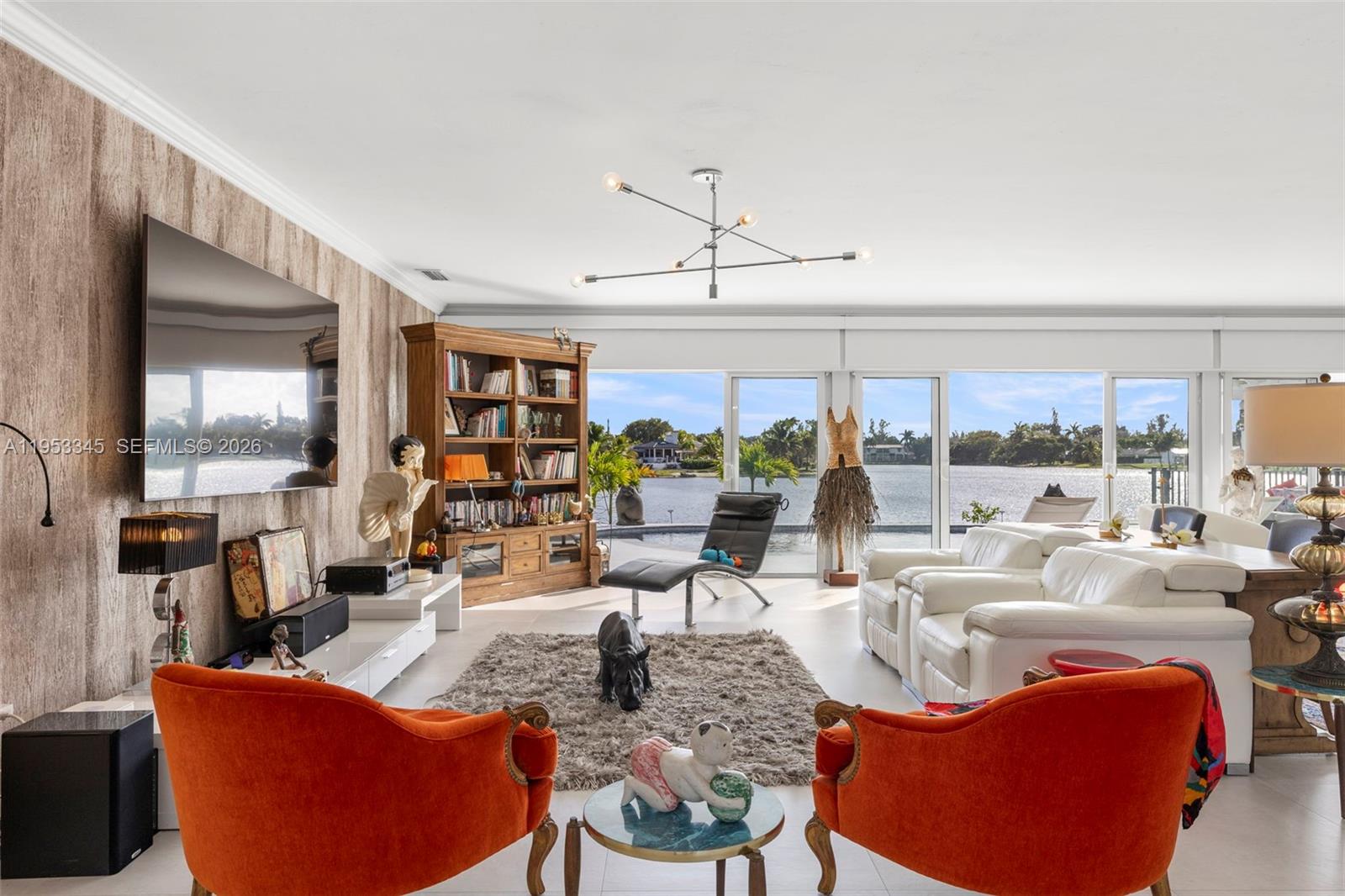 6830 Winged Foot Drive Hialeah, FL 33015 - Photo 27 of 28 a living room with furniture large window and flat screen tv