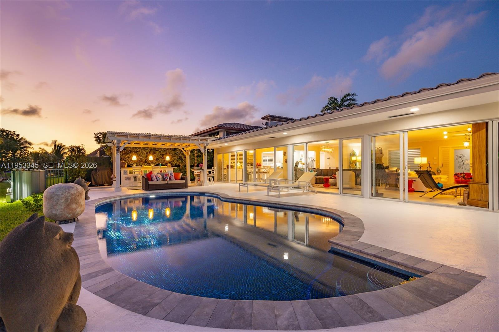 6830 Winged Foot Drive Hialeah, FL 33015 - Photo 4 of 28 a view of a swimming pool with an outdoor seating