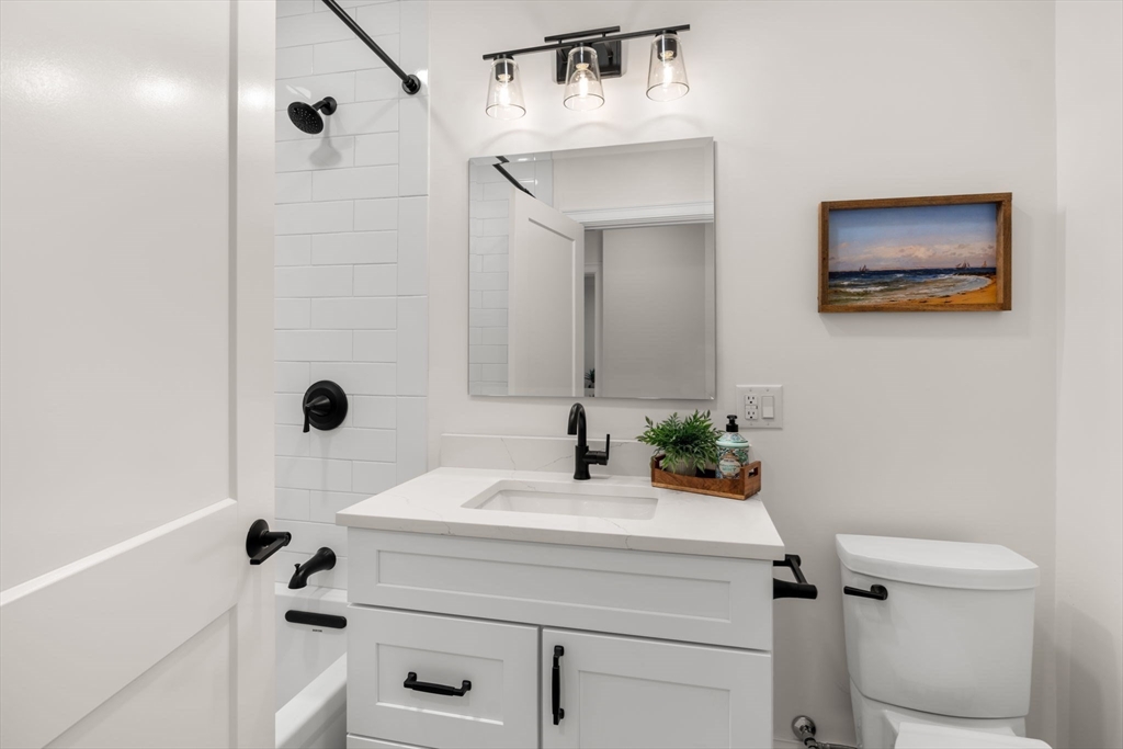 16 Franklin Street, Unit 2403 Salem, MA 01970 - Photo 24 of 40 a bathroom with a sink a toilet and shower