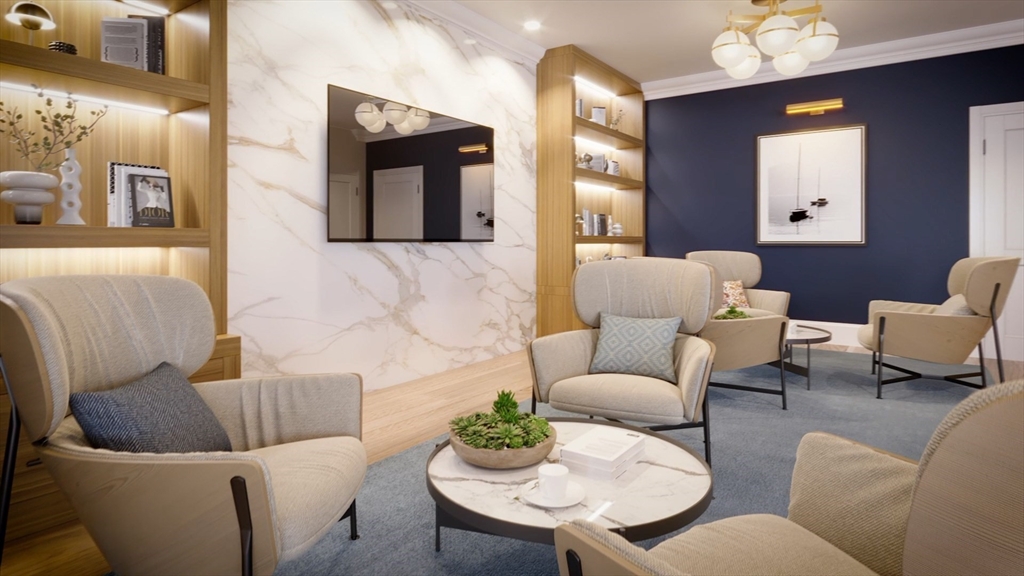 16 Franklin Street, Unit 2403 Salem, MA 01970 - Photo 36 of 40 a living room with furniture and a potted plant