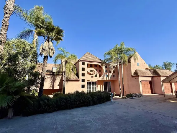 a view of a street with a building in the background