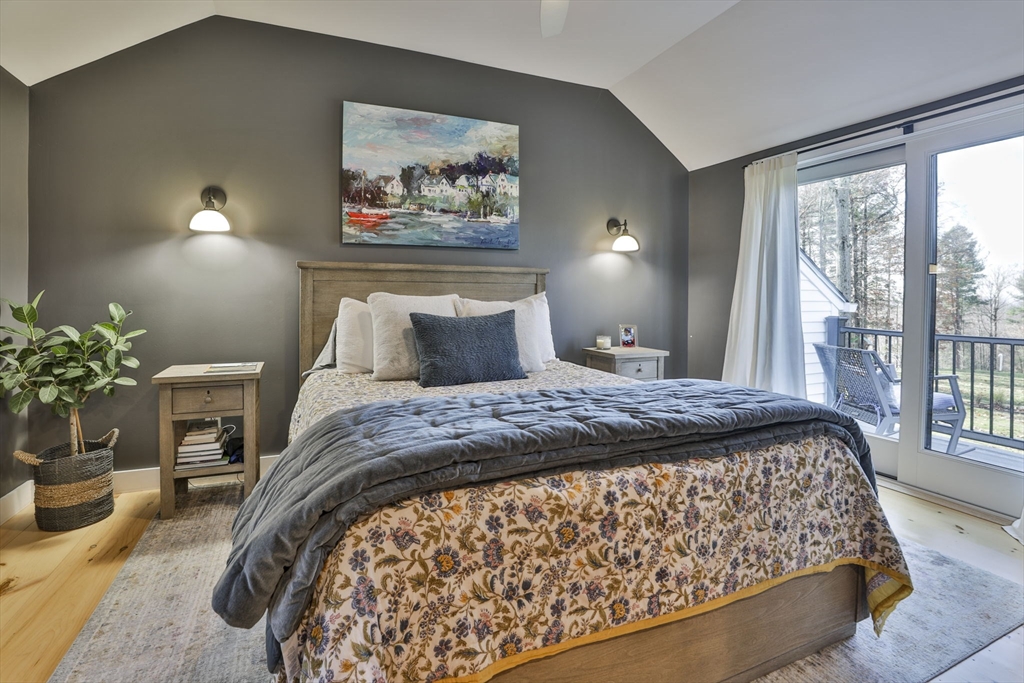60 Bolton Road Harvard, MA 01451 - Photo 13 of 30 a bedroom with a large bed and a painting on the wall