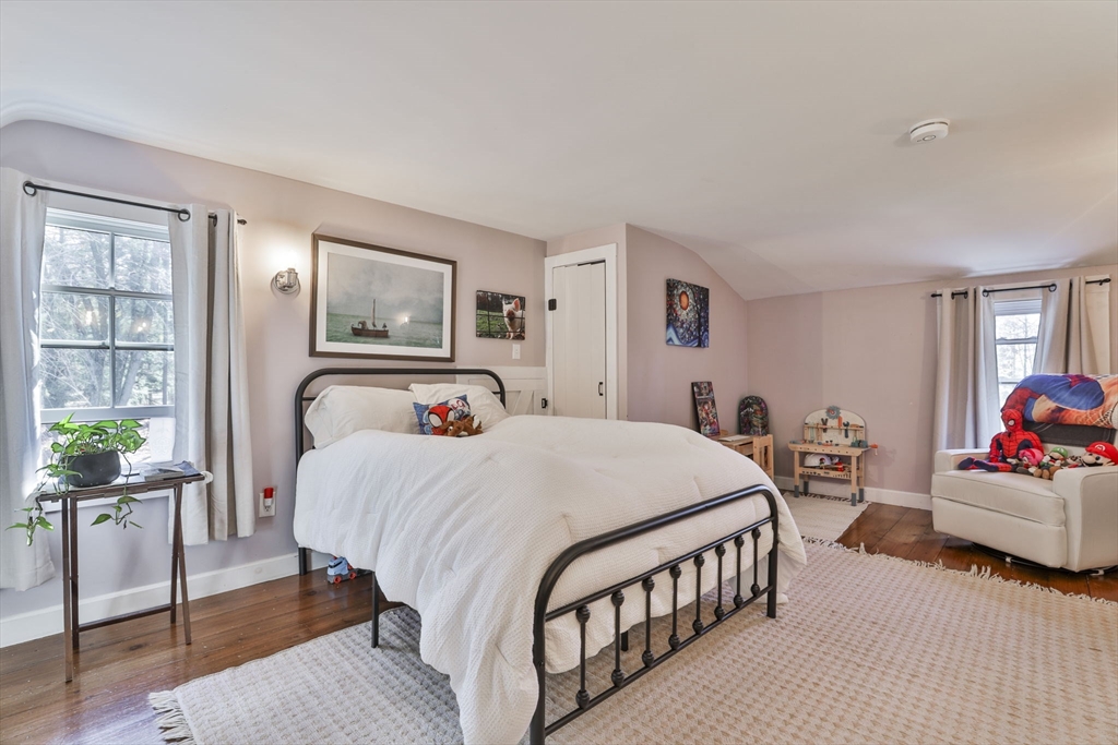 60 Bolton Road Harvard, MA 01451 - Photo 18 of 30 a bedroom with a bed and a couch