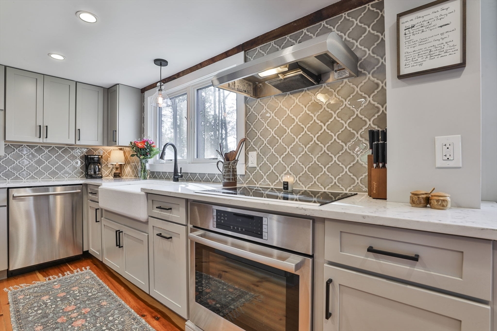 60 Bolton Road Harvard, MA 01451 - Photo 6 of 30 a kitchen with a sink window and cabinets