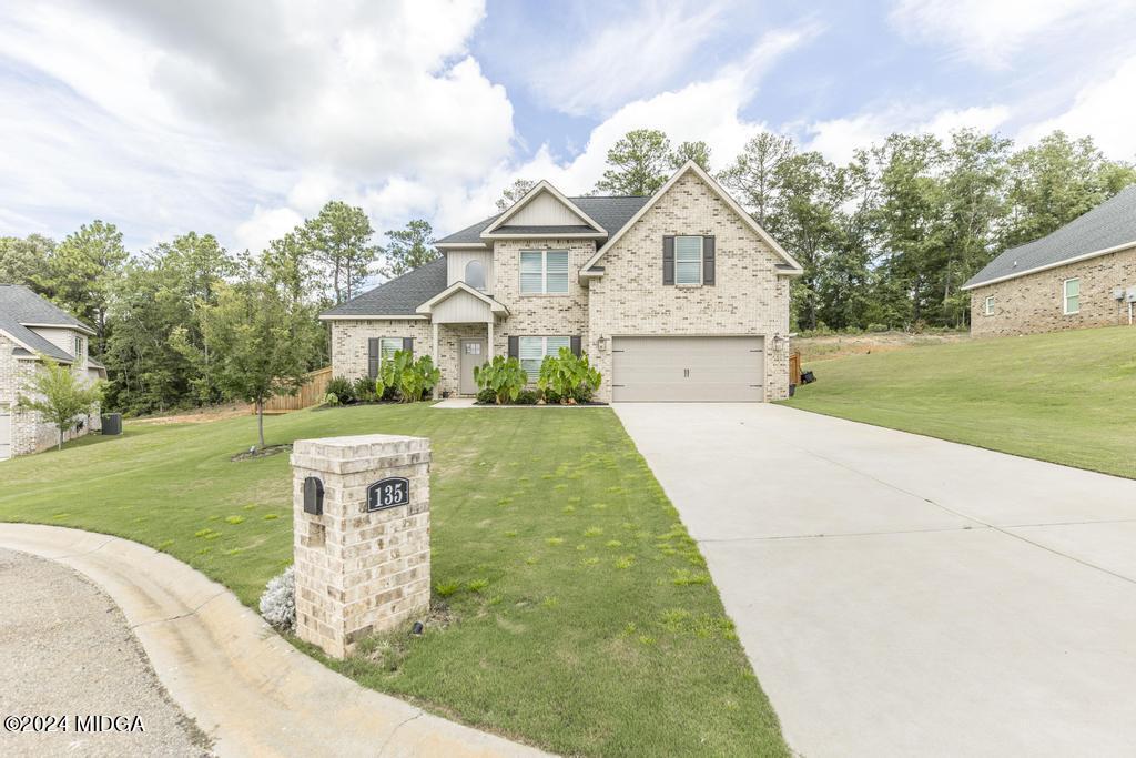 135 Timber Ridge Boulevard Byron, GA 31008 - Photo 2 of 36 a front view of a house with garden