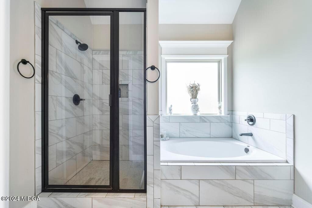 135 Timber Ridge Boulevard Byron, GA 31008 - Photo 22 of 36 a bathroom with a tub shower and a sink