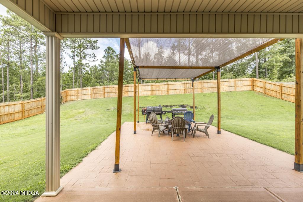 135 Timber Ridge Boulevard Byron, GA 31008 - Photo 32 of 36 a view of outdoor space with seating area and swimming pool in the back
