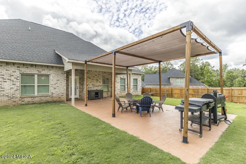 135 Timber Ridge Boulevard Byron, GA 31008 - Photo 33 of 36 a patio with table and chairs
