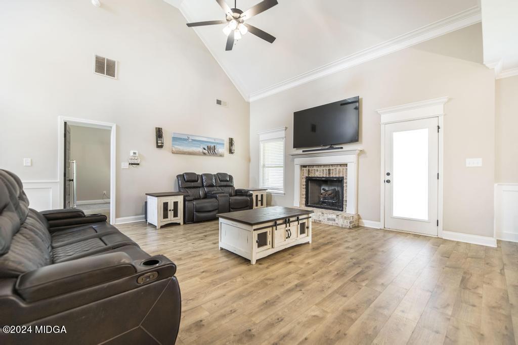 135 Timber Ridge Boulevard Byron, GA 31008 - Photo 7 of 36 a living room with furniture fireplace and flat screen tv