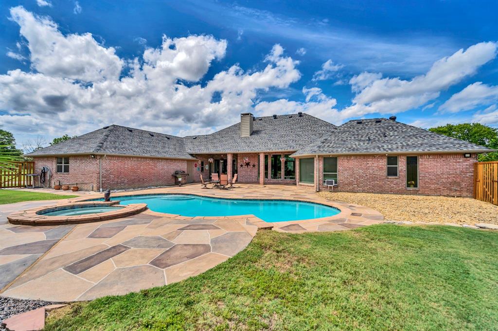 50 Buckingham Lane Allen, TX 75002 - Photo 36 of 39 View of swimming pool with a patio area and a pool with connected hot tub