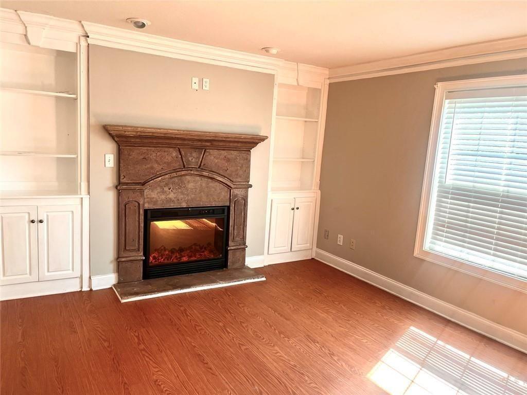 4430 Tilly Mill Road, Unit 104 Dunwoody, GA 30360 - Photo 11 of 37 a living room with a fireplace