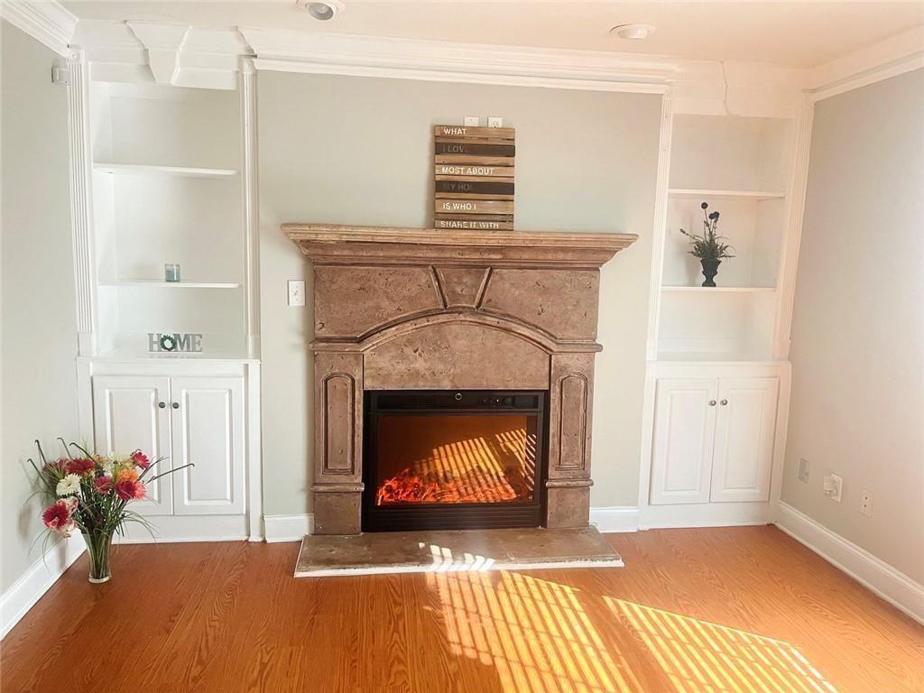 4430 Tilly Mill Road, Unit 104 Dunwoody, GA 30360 - Photo 13 of 37 a living room with furniture and a fireplace