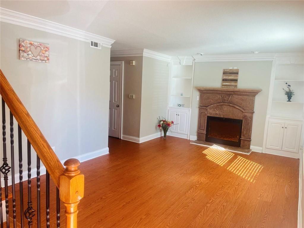 4430 Tilly Mill Road, Unit 104 Dunwoody, GA 30360 - Photo 14 of 37 a view of an empty room with a fireplace