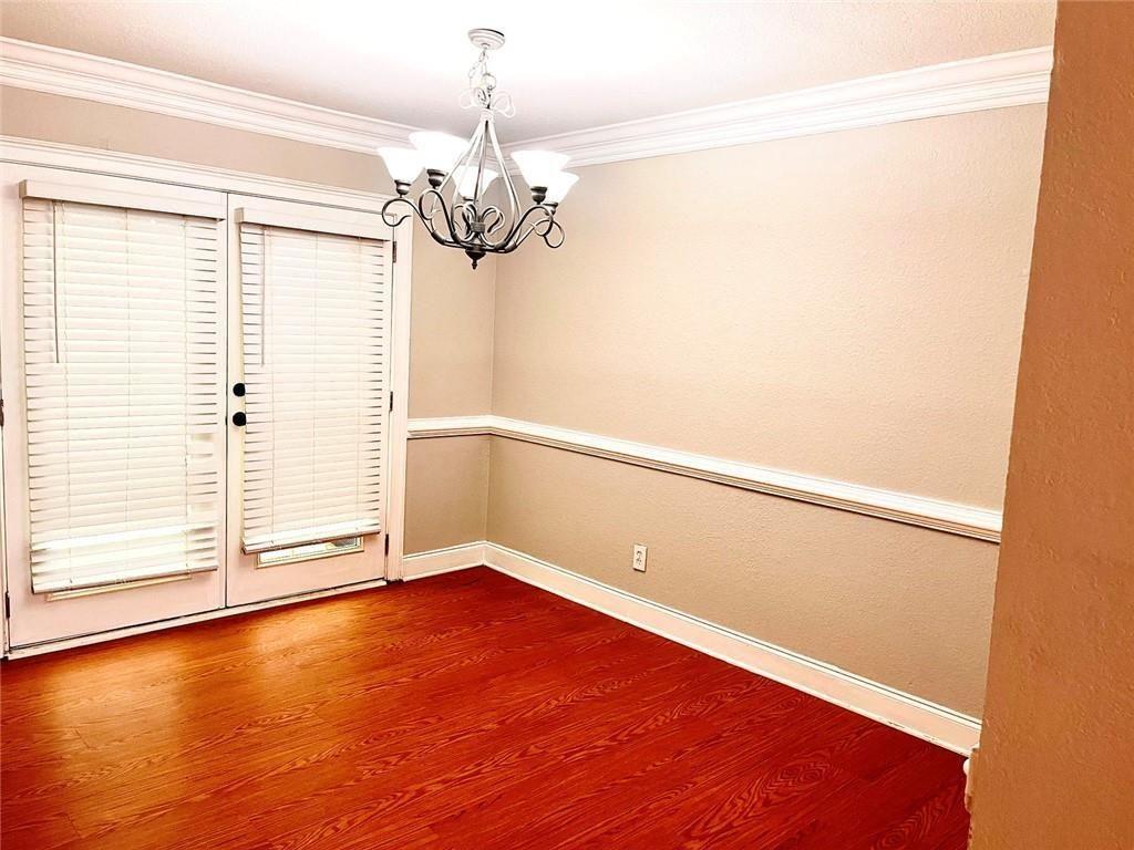 4430 Tilly Mill Road, Unit 104 Dunwoody, GA 30360 - Photo 17 of 37 a view of a room with wooden floor and a window