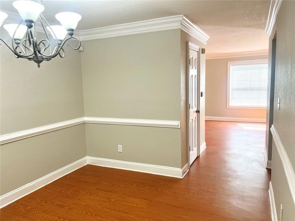 4430 Tilly Mill Road, Unit 104 Dunwoody, GA 30360 - Photo 20 of 37 a view of a room with wooden floor and window