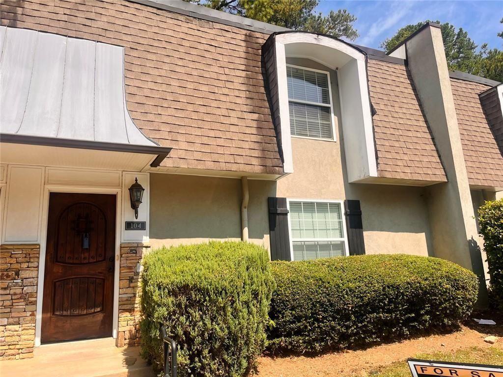 4430 Tilly Mill Road, Unit 104 Dunwoody, GA 30360 - Photo 3 of 37 a front view of a house with a yard
