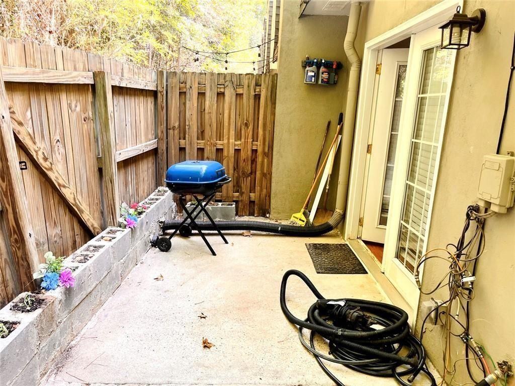 4430 Tilly Mill Road, Unit 104 Dunwoody, GA 30360 - Photo 37 of 37 a view of a balcony with table and chairs