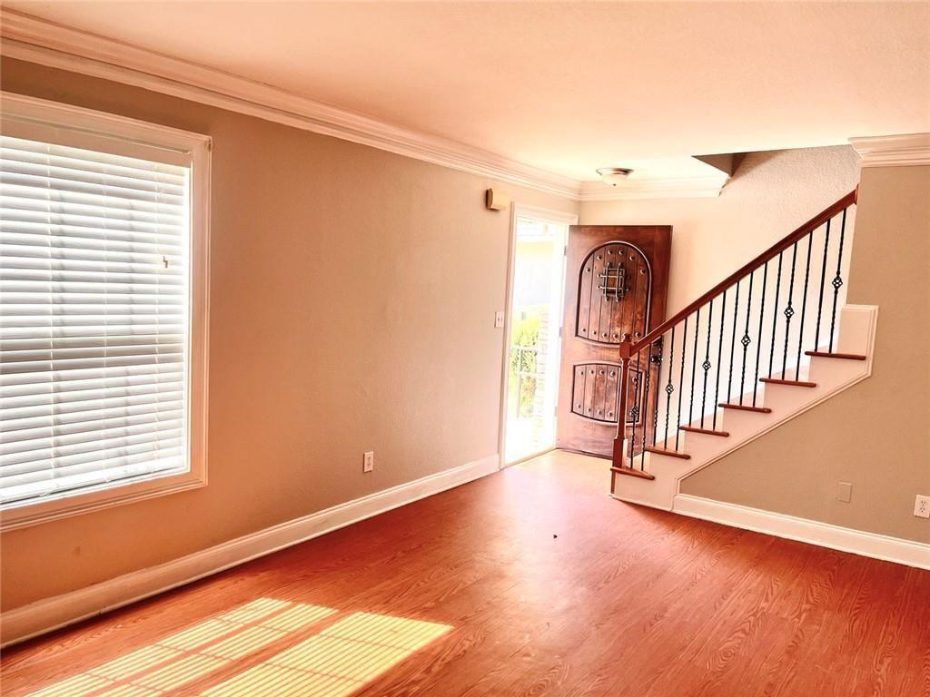 4430 Tilly Mill Road, Unit 104 Dunwoody, GA 30360 - Photo 7 of 37 a view of entryway with stairs and wooden floor