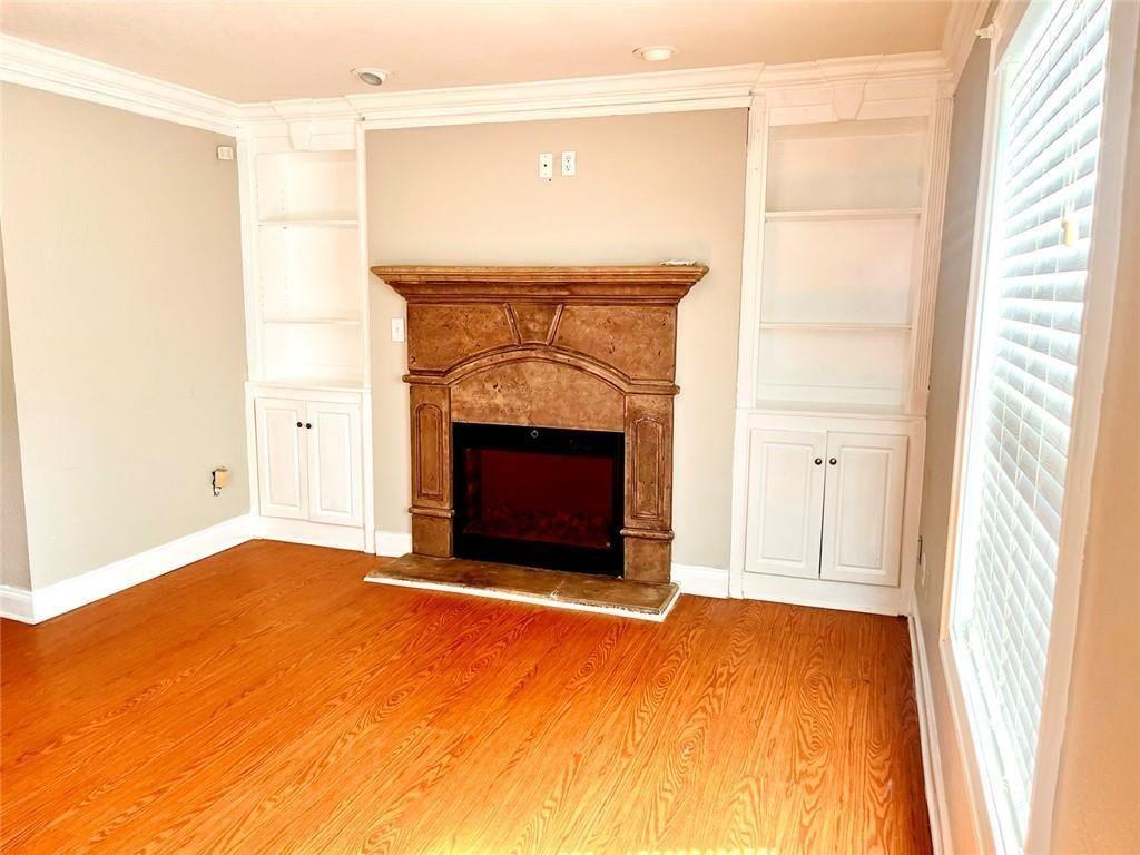 4430 Tilly Mill Road, Unit 104 Dunwoody, GA 30360 - Photo 9 of 37 a view of empty room with a fireplace