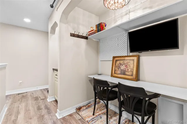 a view of a livingroom with furniture and flat screen tv
