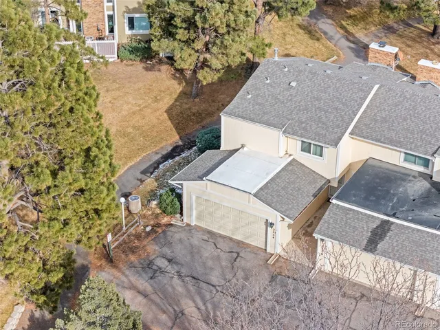 a aerial view of a house with a yard