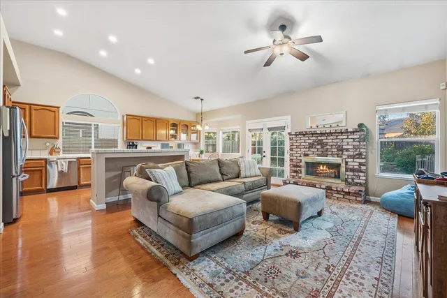a living room with furniture fireplace and flat screen tv