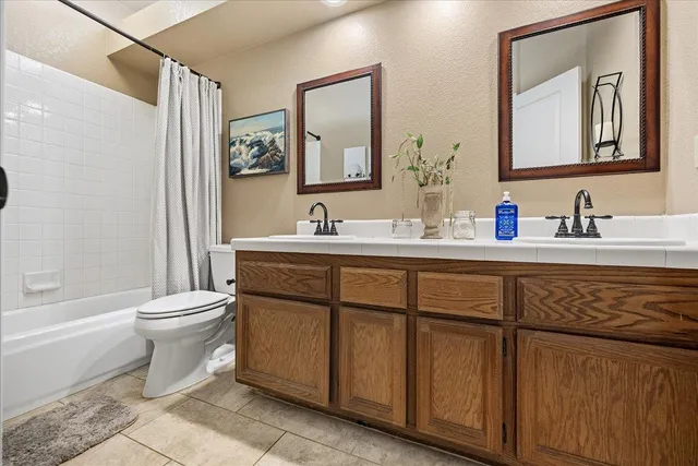 a bathroom with a toilet a sink and a mirror