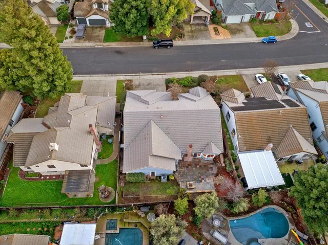 an aerial view of house with yard