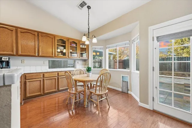 a view of a dining room with furniture window and outside view