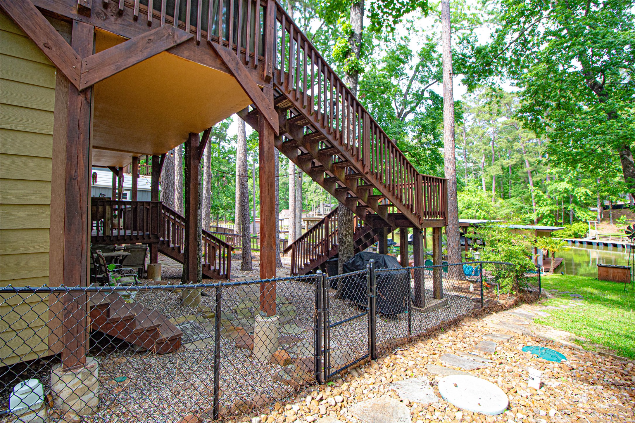 70 Lower Cove Drive Point Blank, TX 77364 - Photo 11 of 50 Another view of this side of the home. privacy gate.