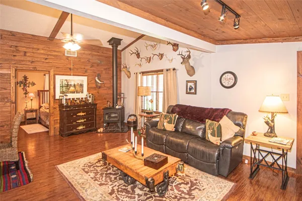 a living room with furniture and wooden floor