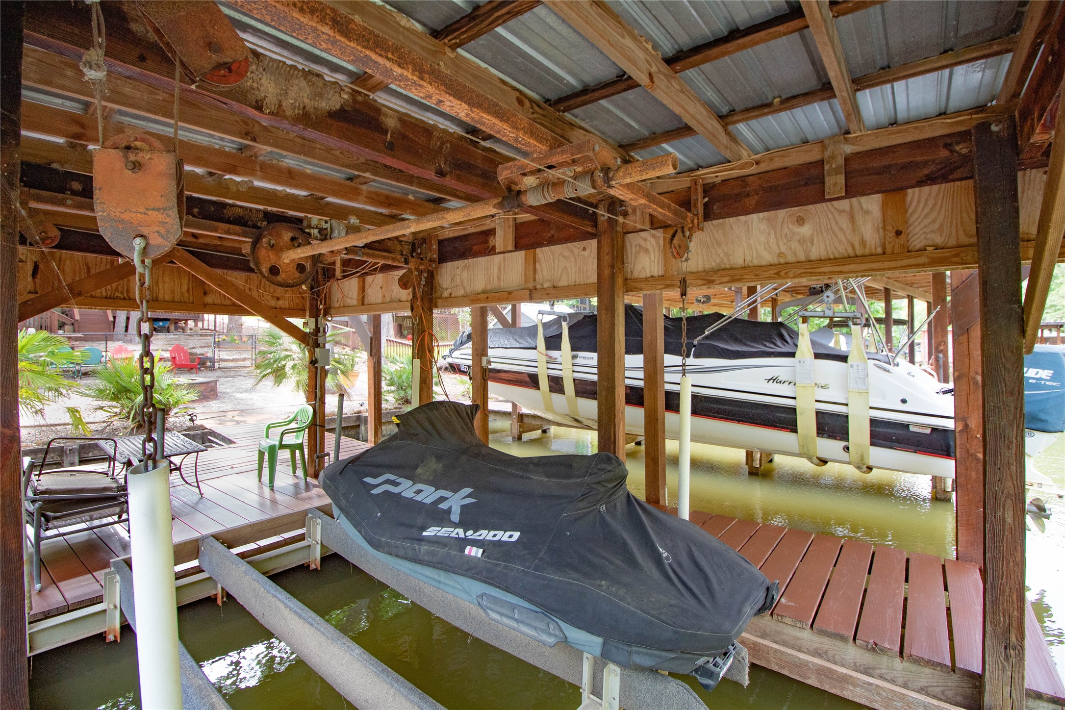 70 Lower Cove Drive Point Blank, TX 77364 - Photo 18 of 50 Two jet ski lifts. Seller will consider selling the jet skis.