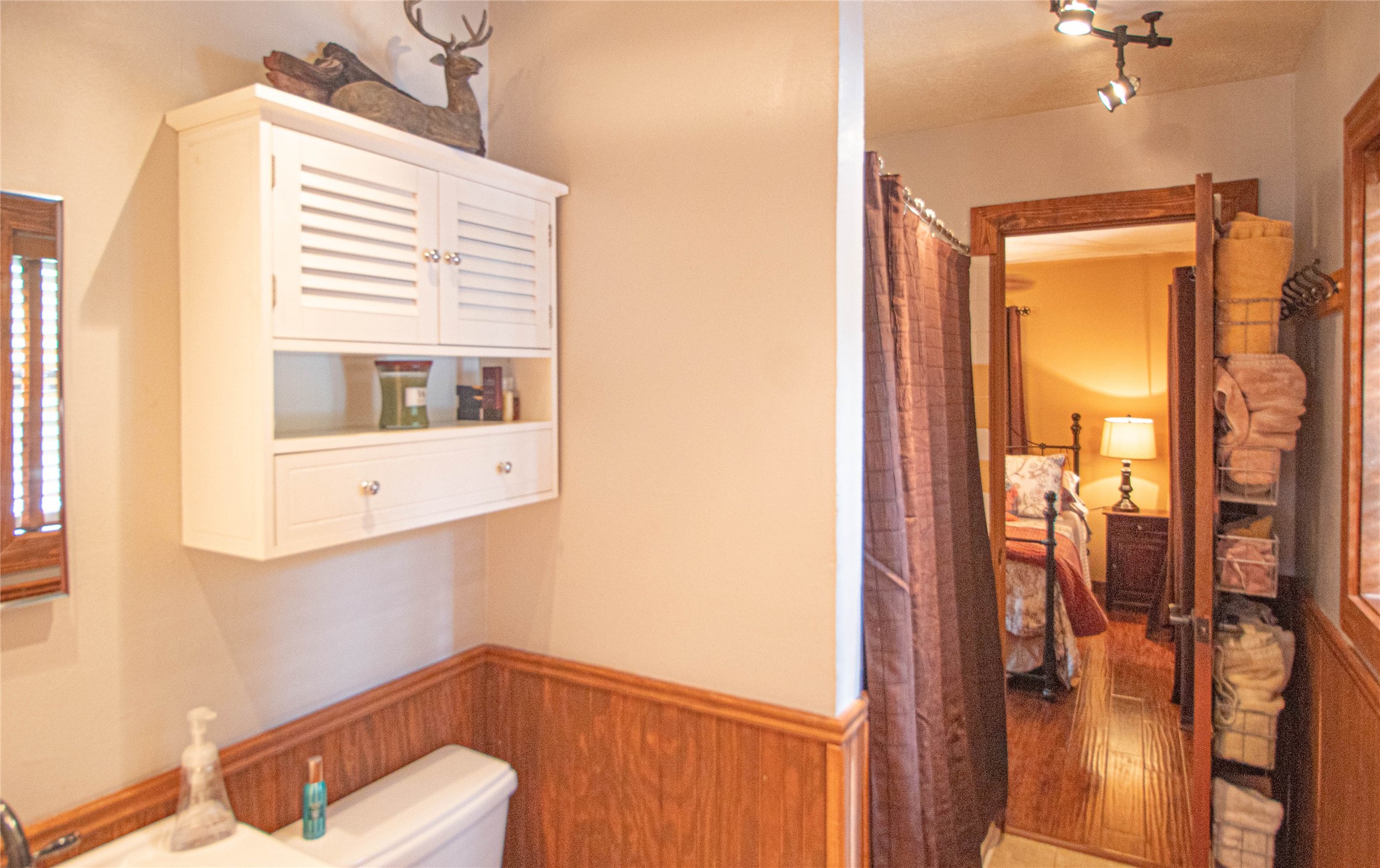 70 Lower Cove Drive Point Blank, TX 77364 - Photo 38 of 50 Beautiful wood floors in both bedrooms. This is one view of the jack'n jill bathroom. Full tub/Shower.