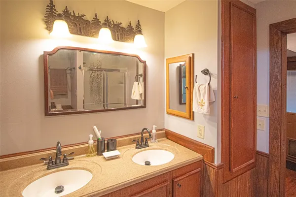 a bathroom with a sink and a mirror