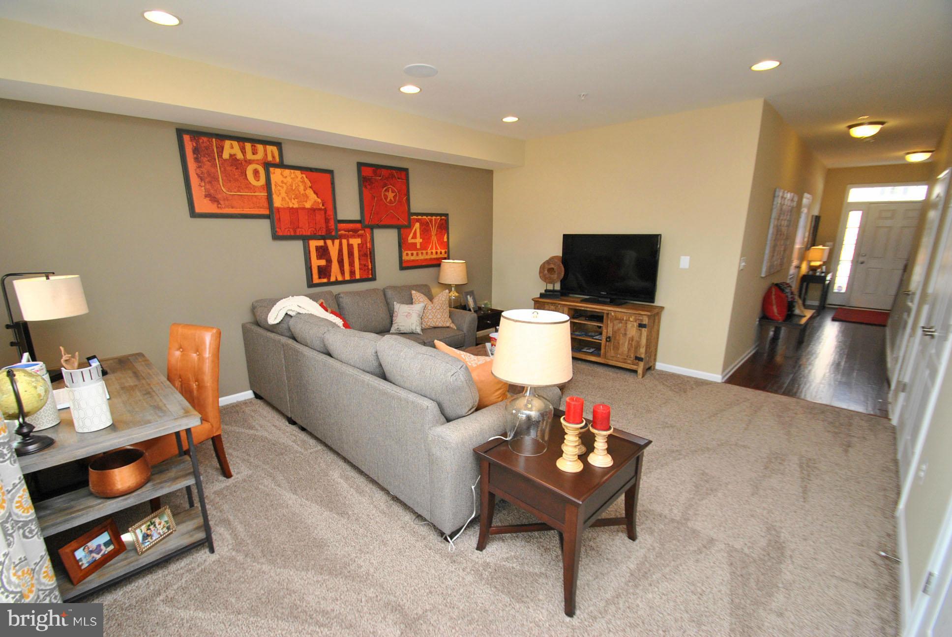 948 Winter Run Road Baltimore, MD 21220 - Photo 4 of 21 a living room with furniture and a flat screen tv