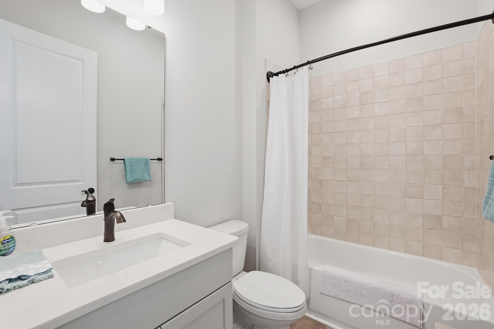 1035 Rabbit Hl Lane Monroe, NC 28110 - Photo 26 of 39 a bathroom with a sink a toilet and a bathtub