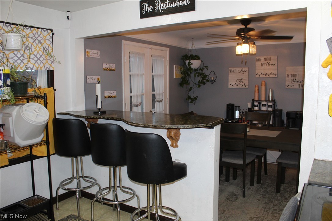 1292 Ford Road Lyndhurst, OH 44124 - Photo 4 of 25 Bar featuring dark countertops