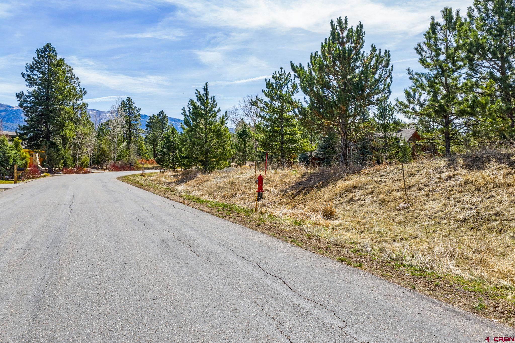 24 Cliffs Edge Drive Durango, CO 81301 - Photo 20 of 21 a backyard of a house with lots of green space