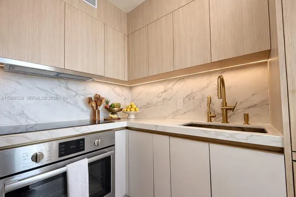 a kitchen with a sink and cabinets