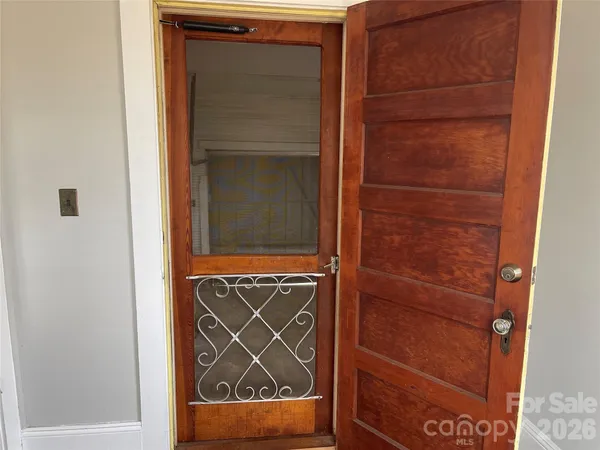 a view of a yard with large trees