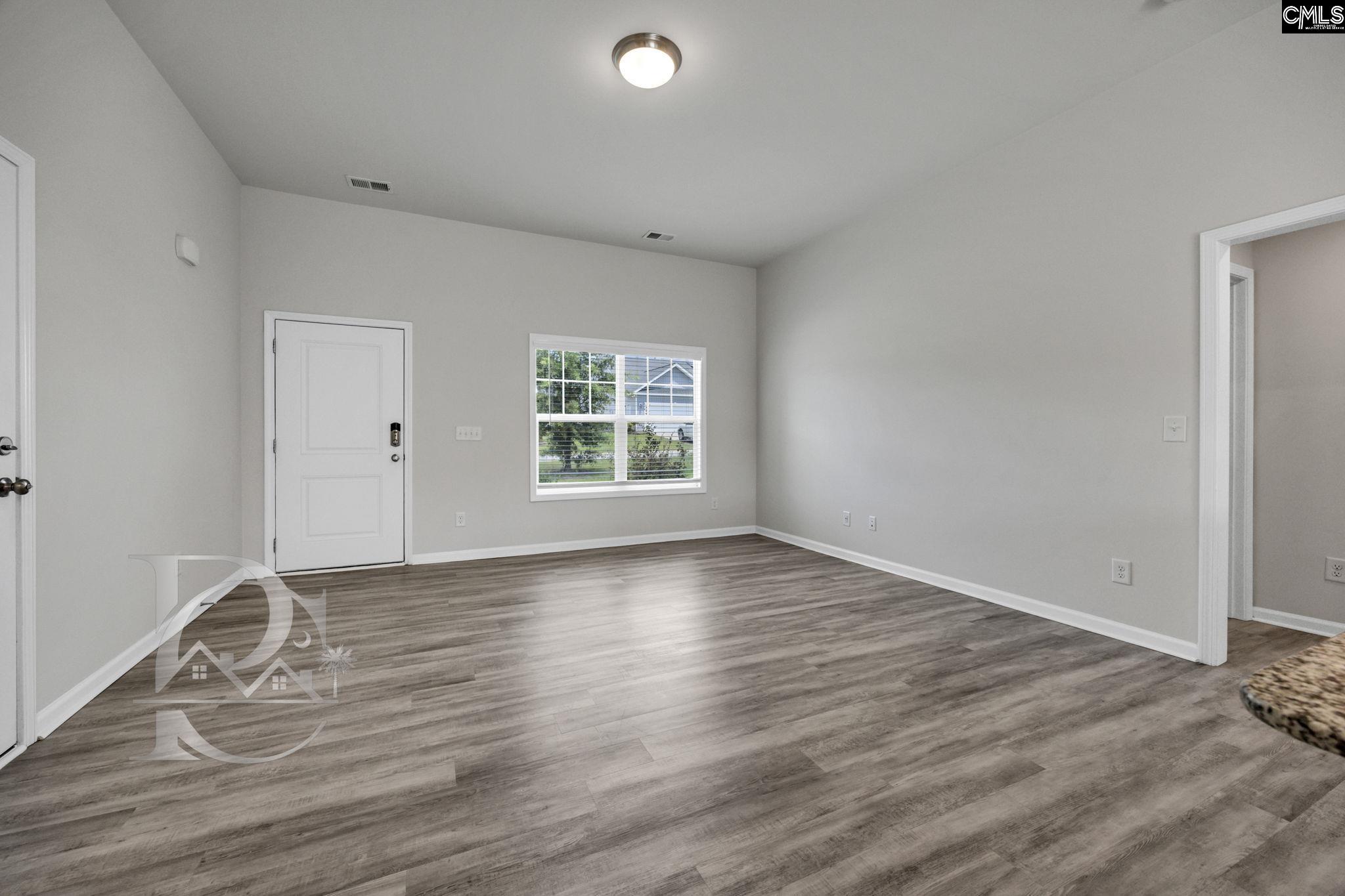 235 Drayton Hall Road West Columbia, SC 29172 - Photo 5 of 24 an empty room with wooden floor and windows
