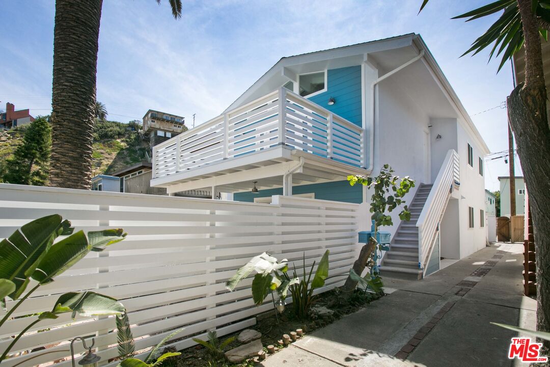 122 Montreal Street Playa del Rey, CA 90293 - Photo 1 of 30 a front view of a house with a garden